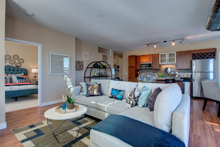 The Penfield St. Paul Apartments Apartment Living Room Kitchen and Dining Area 01 768x513