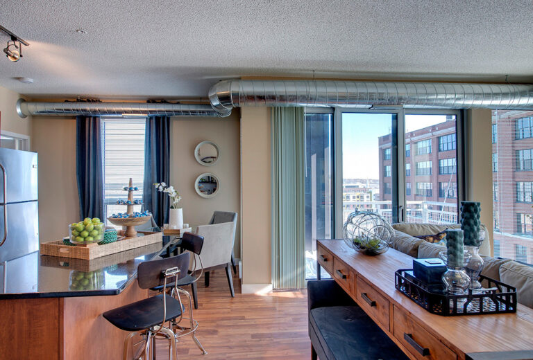 The Penfield St. Paul Apartments Apartment Living Room and Kitchen 768x520